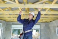 woman construction worker wearing white helmet and tools belt bag Royalty Free Stock Photo