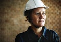 Woman constructor wearing hard helmet