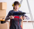 Woman contractor with hand drill at construction site Royalty Free Stock Photo