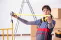 The woman contractor with measuring tape