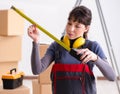 Woman contractor with measuring tape