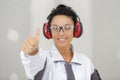 woman contractor worker cancelling headphones Royalty Free Stock Photo