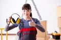The woman contractor worker with noise cancelling headphones Royalty Free Stock Photo