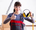 Woman contractor worker with noise cancelling headphones Royalty Free Stock Photo