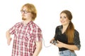 Woman controling man using gaming pad Royalty Free Stock Photo