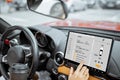 Woman controlling car with a digital dashboard Royalty Free Stock Photo