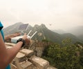 Woman controlling flying drone