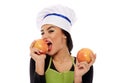 Woman cook biting grapefruit Royalty Free Stock Photo