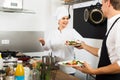 Woman cook giving salad to waitress Royalty Free Stock Photo