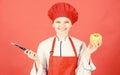 Woman in cook hat and apron. professional chef in kitchen. Cuisine. Housewife with cooking knife. happy woman cooking Royalty Free Stock Photo