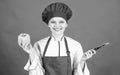 Woman in cook hat and apron. professional chef in kitchen. Cuisine. Housewife with cooking knife. happy woman cooking Royalty Free Stock Photo