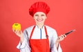 Woman in cook hat and apron. professional chef in kitchen. Cuisine. Housewife with cooking knife. happy woman cooking Royalty Free Stock Photo