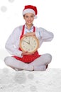 Woman cook in Santa hat, yoga clock under snow