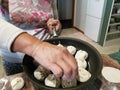 A woman cooking asian dumplings