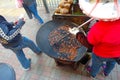 Woman cooking Asian food in the street of dowtown in Hong Kong city. According to the Food and Agriculture Organization, 2.5 billi