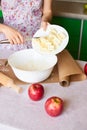 Woman cooking dough for cake, she mixing butter and flour on the bowl on the white table Royalty Free Stock Photo