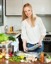 Woman cooking fish in sheet pan