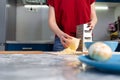 Woman cooking in the kitchen, grating cheese. Hands close-up. The concept of a home-cooked meal