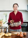 Woman cooking mushrooms Royalty Free Stock Photo