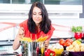 Woman cooking pasta in kitchen Royalty Free Stock Photo