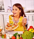 Woman cooking pizza Royalty Free Stock Photo