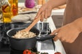 Woman cooking rice in kitchen Royalty Free Stock Photo