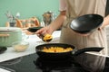 Woman cooking rice on stove in kitchen Royalty Free Stock Photo