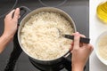 Woman cooking rice on stove in kitchen Royalty Free Stock Photo