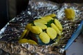 Woman is cooking salmon fish with with potatoes and and dill in foil. Royalty Free Stock Photo