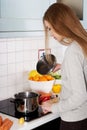 Woman cooking soup