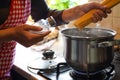 Woman cooking spaghetti on stove in kitchen, closeup Royalty Free Stock Photo