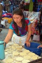 Woman cooking tortillas