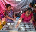 Woman cooking tortillas