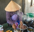 A woman cooking traditional cake in Phan Rang, Vietnam