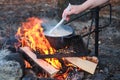 A woman is cooking a traditional Finnish soup.