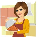 Woman cooking traditional thanksgiving turkey