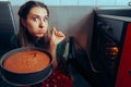 Woman Cooking Using a Toothpick Checking on her Baked Cake.