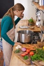 Woman, cooking and vegetable at tasting in kitchen for vegetarian dinner, nutrition or raw ingredients. Female person Royalty Free Stock Photo