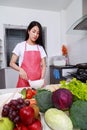 Woman cooking and whisking eggs in a bowl in kitchen room Royalty Free Stock Photo