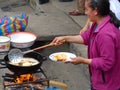 Woman cooks street food Cheese Empanadas, Ecuador