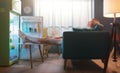 Woman cooling herself in front of the open fridge