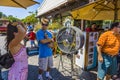 Woman cools down at a ventilator in the heat of the day in Los Angeles