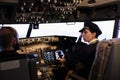 Woman copilot in uniform flying airplane with cockpit command