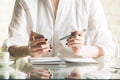 Woman copying information from cellphone