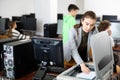 Woman copying notes on copy machine in library computer lab Royalty Free Stock Photo