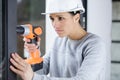 woman with cordless drill ready for home repairs Royalty Free Stock Photo