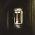 Woman in the corridor in an old tenement house Royalty Free Stock Photo