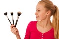 Woman with cosmetics brushes for makeup isolated.