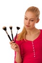 Woman with cosmetics brushes for makeup isolated.