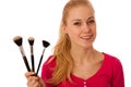 Woman with cosmetics brushes for makeup isolated.